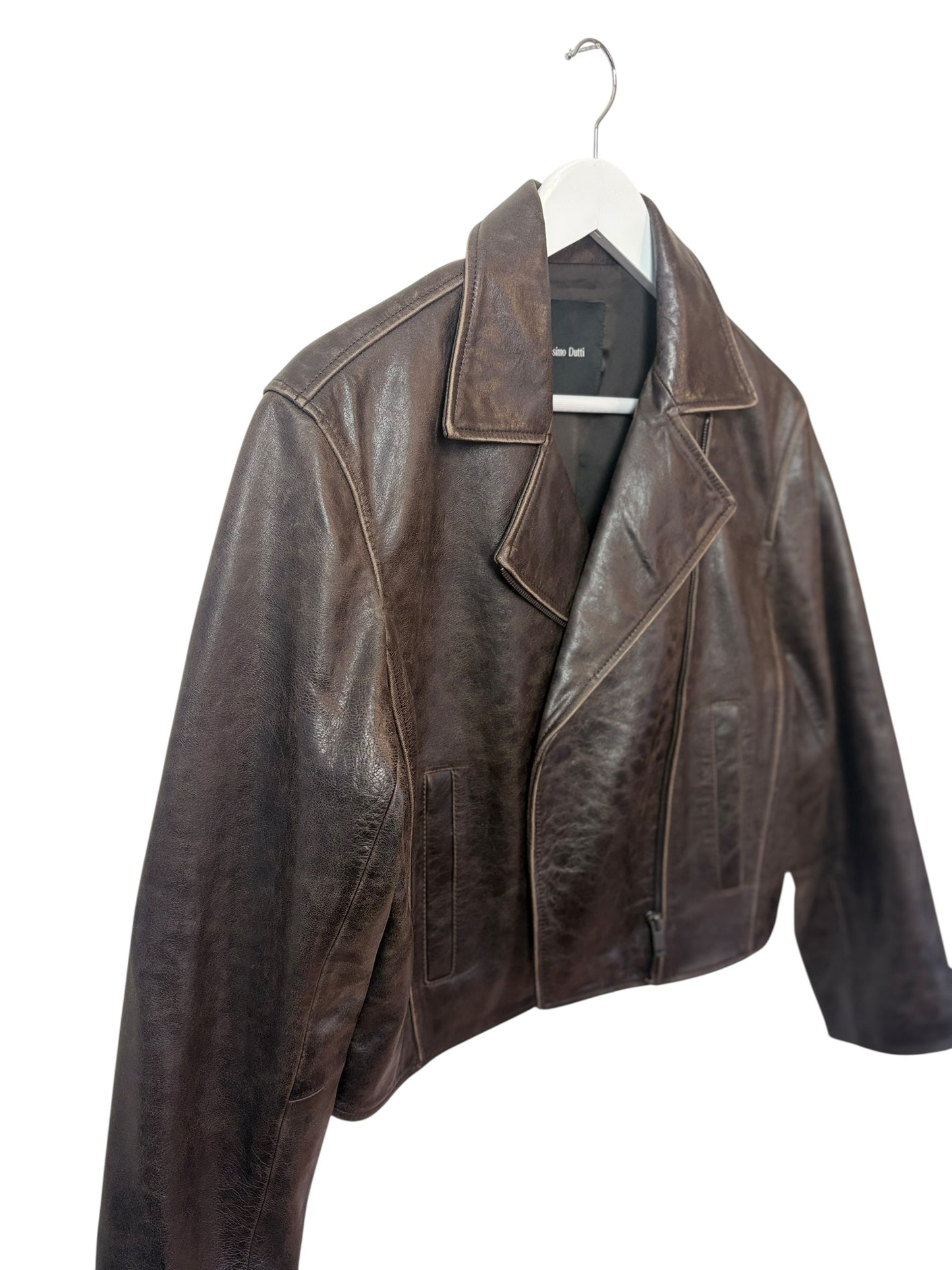 The side view of brown leather  biker jacket on a white hanger white background