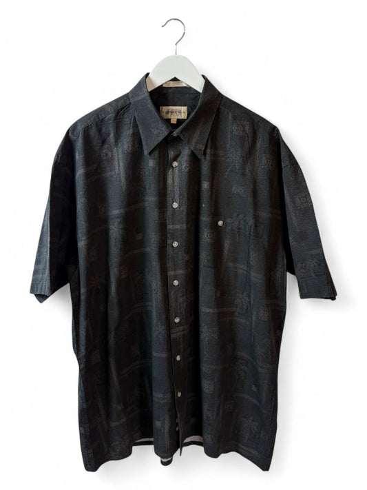 DESCRIPTION

Vintage Campia shirt with a mix of tribal motifs, masks, and palm trees stitched into deep black-brown fabr