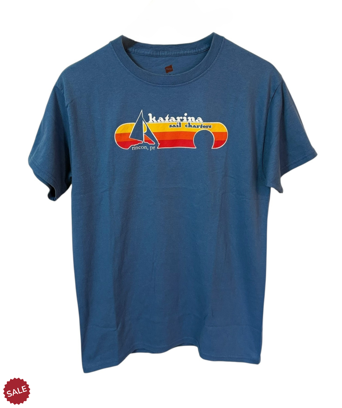 Blue T- Shirt with Katarina Sail Charters, featuring nautical graphics that celebrate seafaring adventures. 