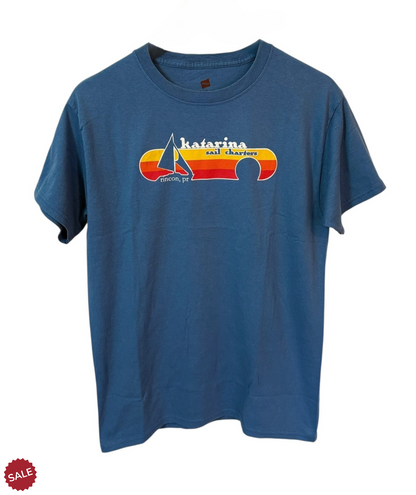 Blue T- Shirt with Katarina Sail Charters, featuring nautical graphics that celebrate seafaring adventures. 
