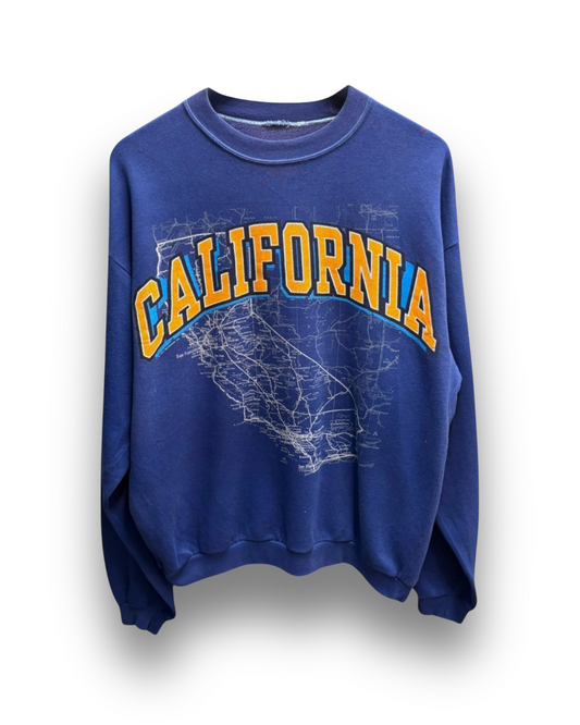 DESCRIPTION

 This is a lightweight blue sweatshirt stamped with California in golden varsity lettering and a white road